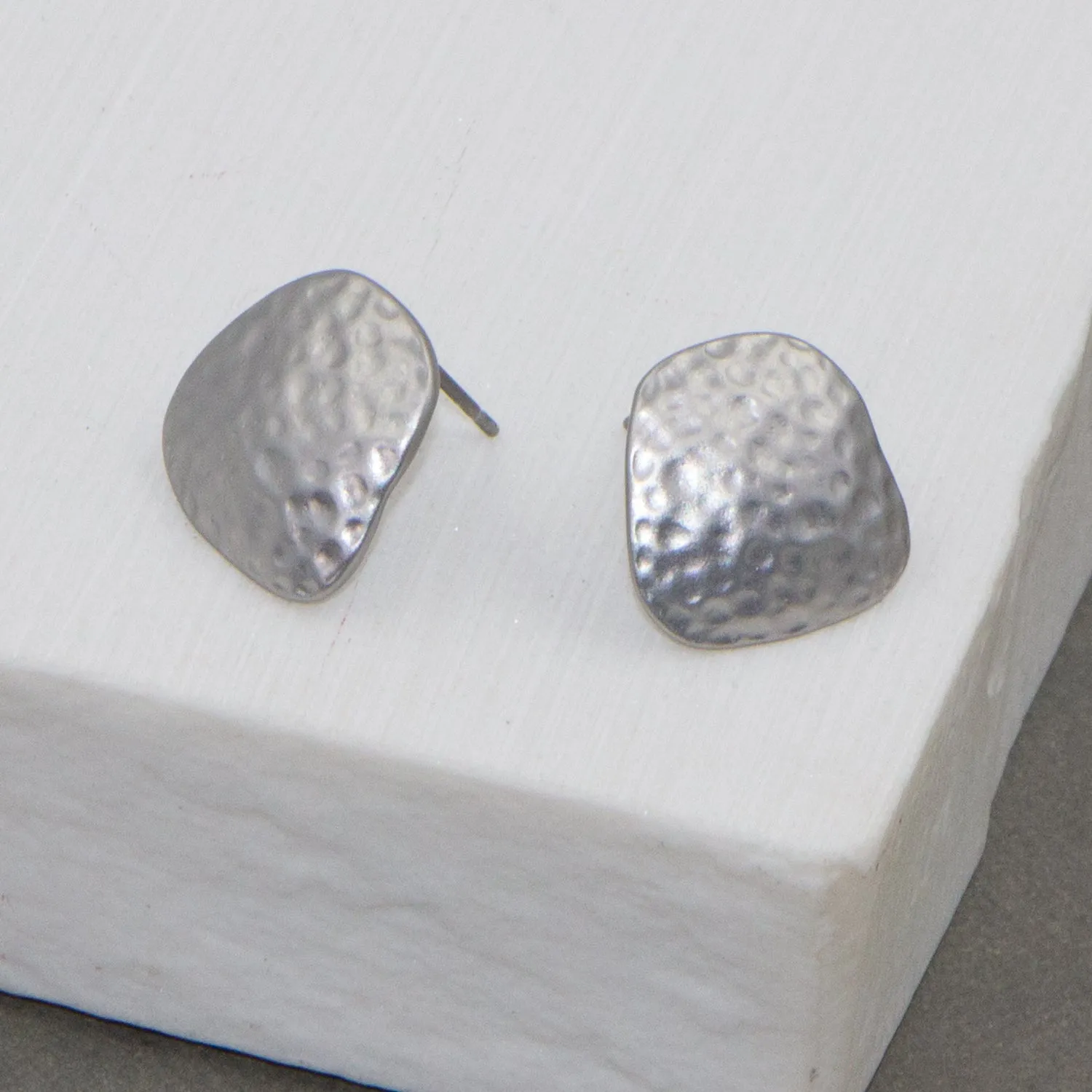 Contemporary beaten effect earrings