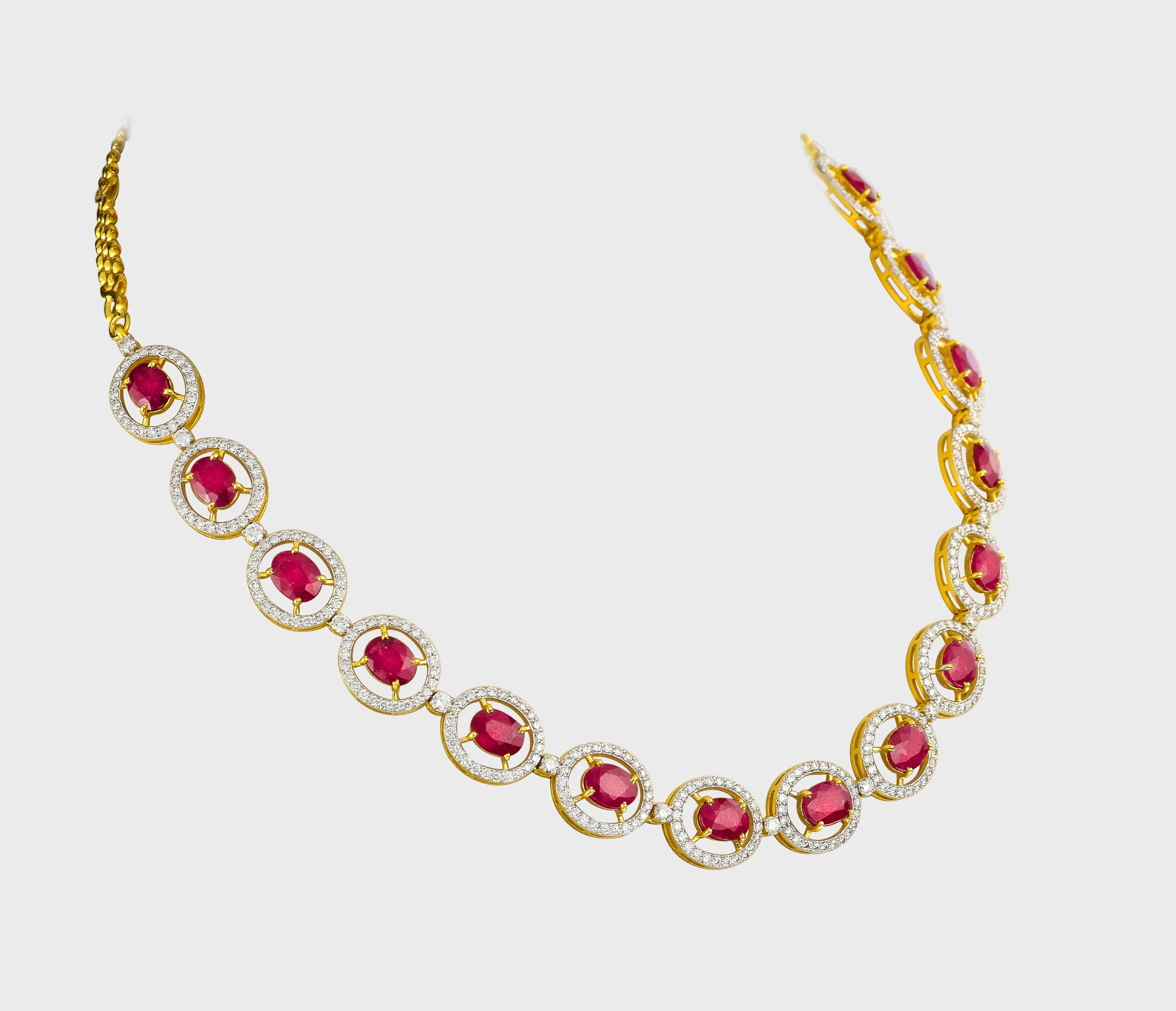 Unveil the epitome of sophistication with our captivating Ruby oval cut necklace and earring pair, adorned with dazzling diamonds.(GDNE0466)