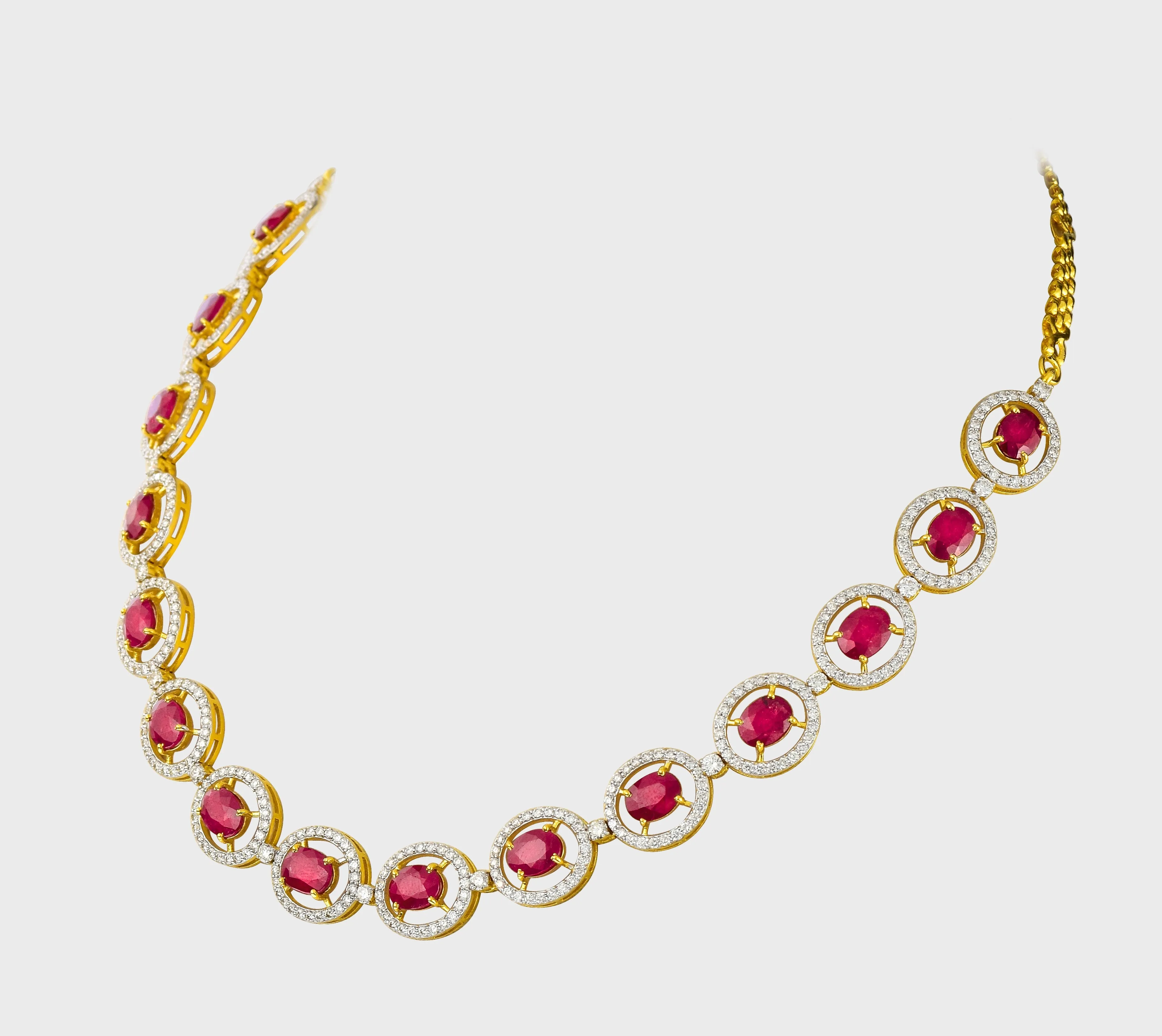 Unveil the epitome of sophistication with our captivating Ruby oval cut necklace and earring pair, adorned with dazzling diamonds.(GDNE0466)