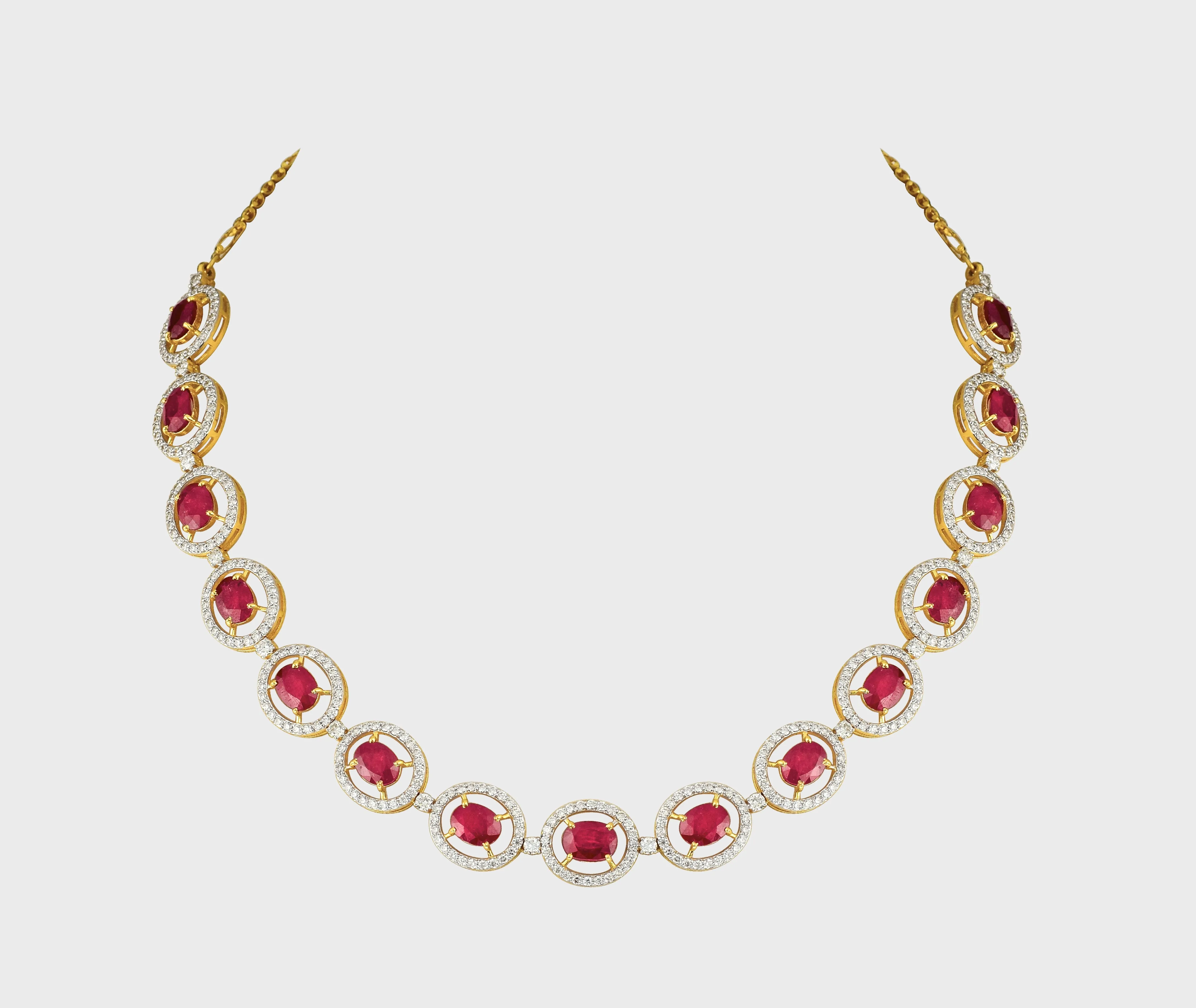 Unveil the epitome of sophistication with our captivating Ruby oval cut necklace and earring pair, adorned with dazzling diamonds.(GDNE0466)